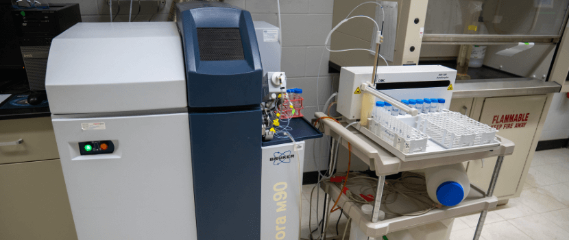Person examining a sample from the plasma mass spectrometer