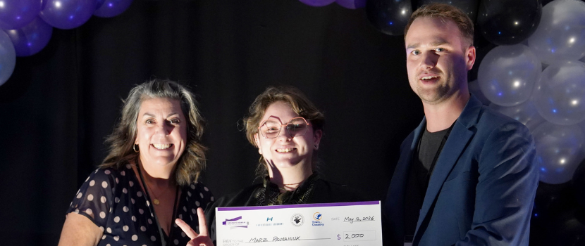 First place prize winner receiving a cheque