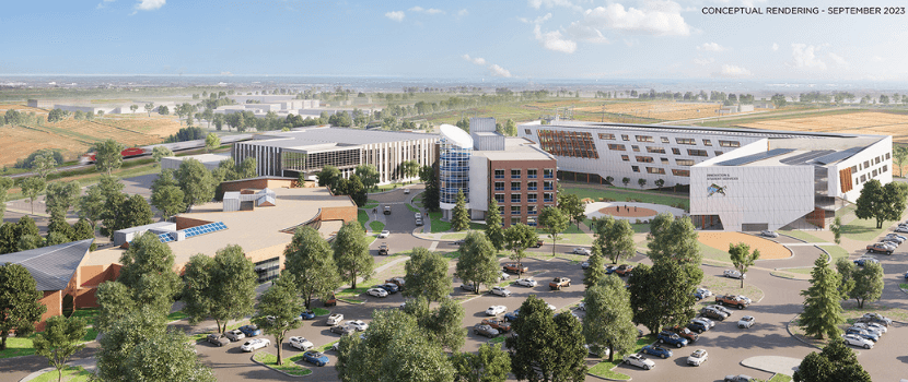 This is an aerial view of the campus from the Galleria Building, looking northeast which includes existing 116 and 121 Research Drive, along with the Trades and Technology and Innovation and Student Services building in the background.