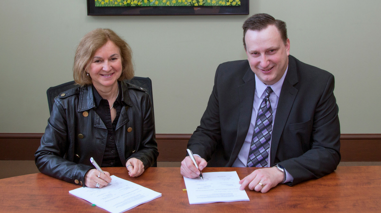 Image credit: Saskatchewan Polytechnic (Paul Carter signing an agreement with NBCC) 