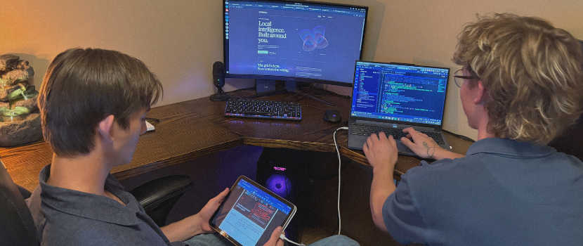 two students in front of a computer