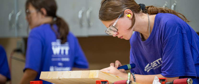 Girls in carpentry shop 