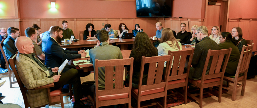 Researchers having a discussion at a table