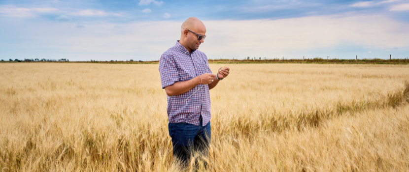 Dr. Rajeev Dhakal standing in a field