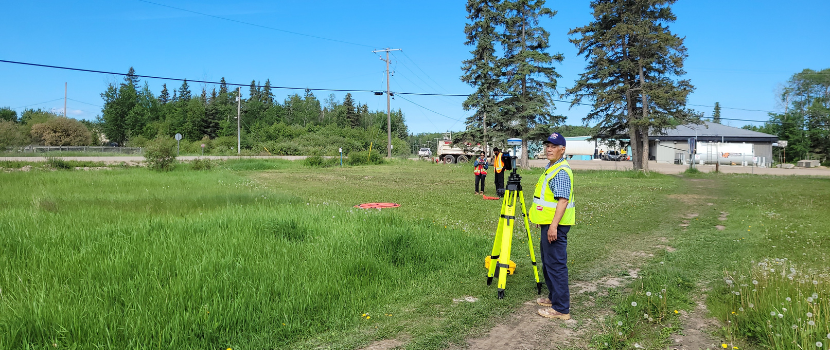one person with survey equipment